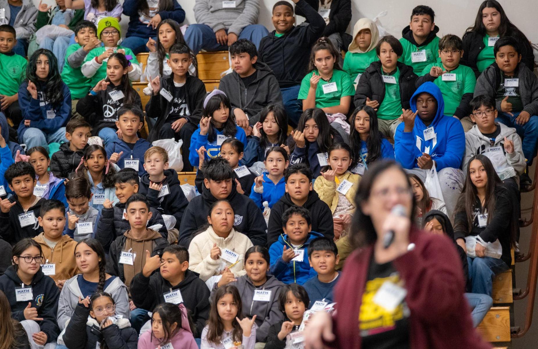 more than 50 students and instructor in gymnasium