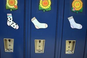 Colorful paper socks stuck to lockers