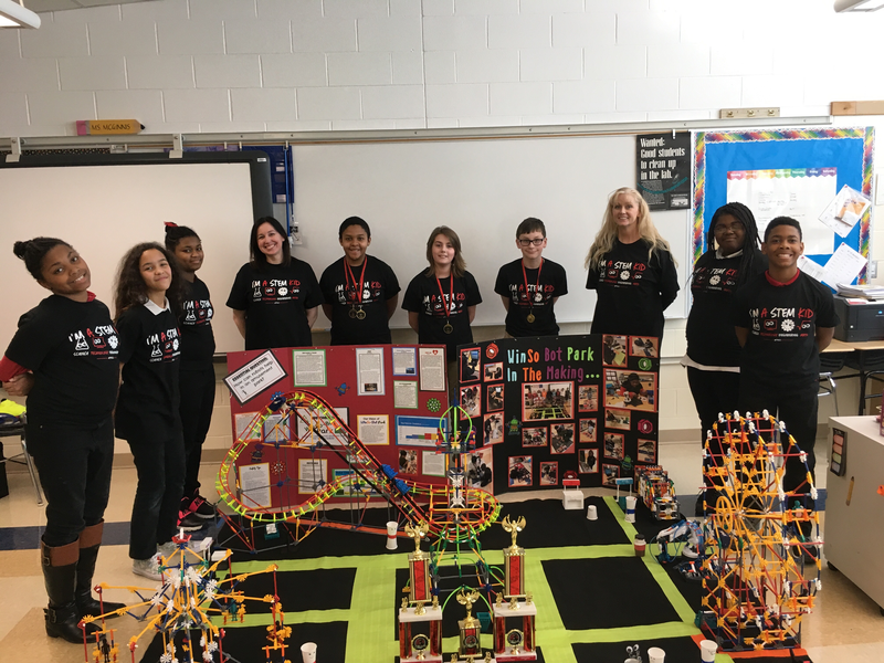 Team McNerds 2.0 posing with their project and robot
