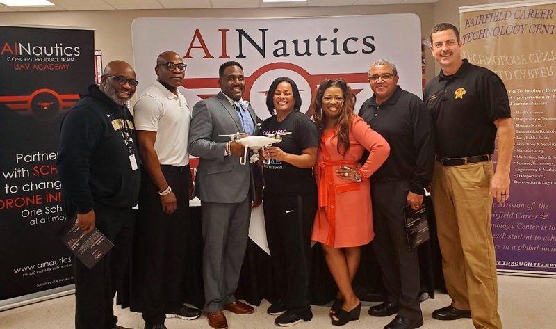 Members of the Fairfield Board, FCTC Director, Assistant standing with AINAUTICS