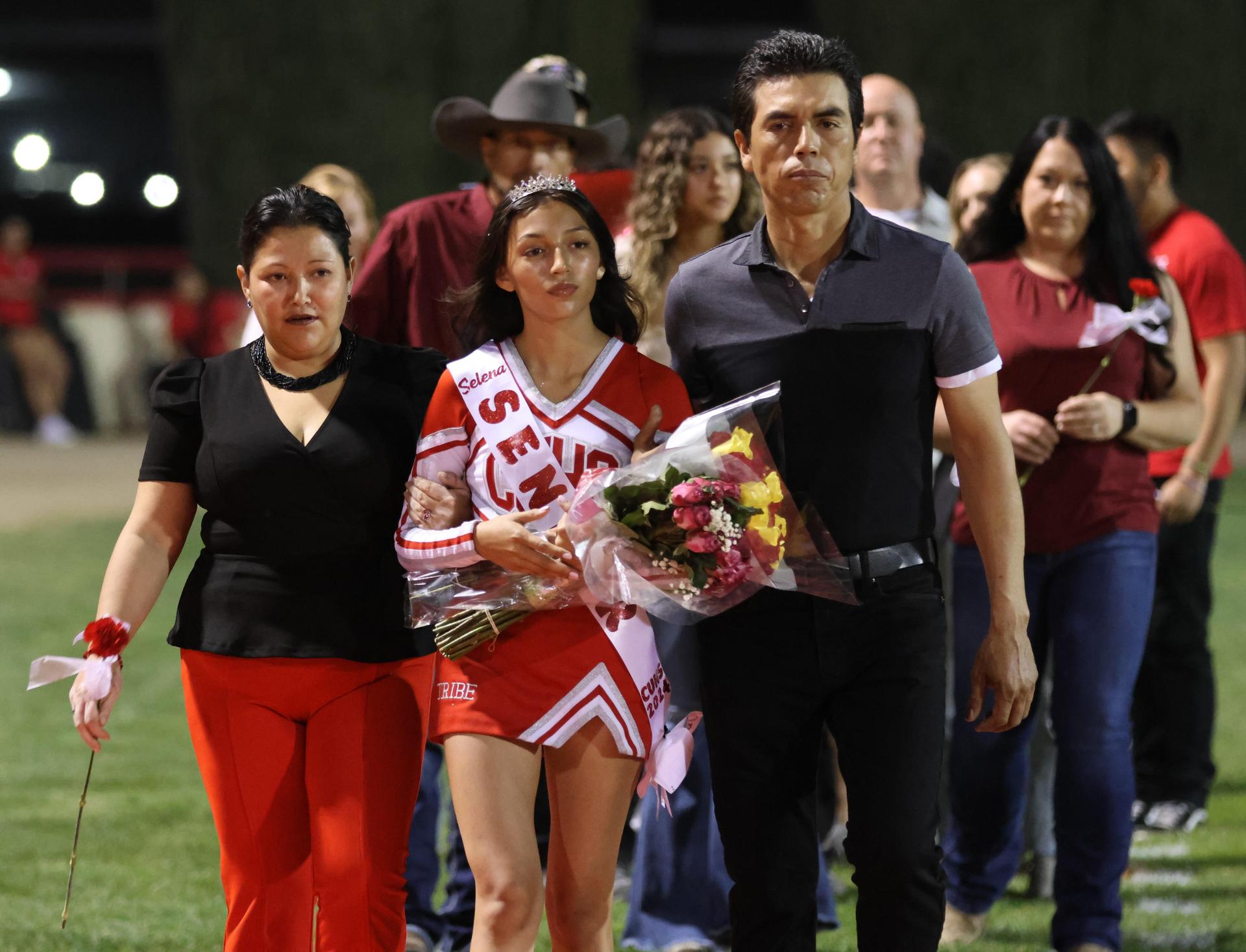 seniors and their escorts celebrating senior night