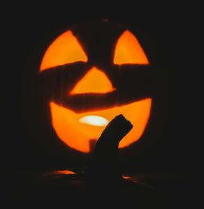 silhouette of a pumpkin with light