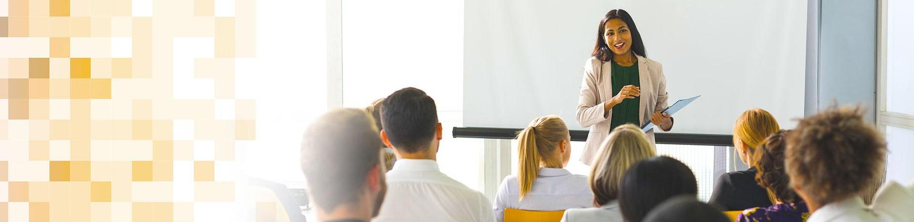 A trainer looking over her audience.