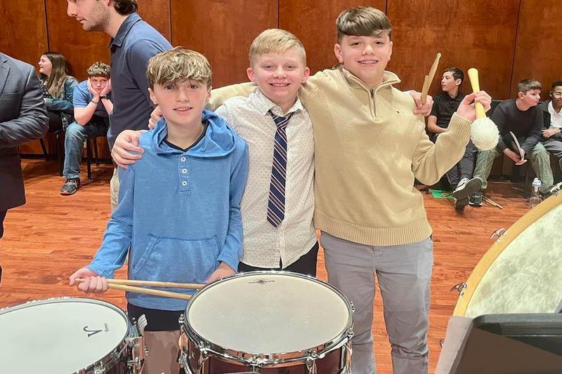 Penn Middle School percussionists Robert Jefferson, Carter Wojtaseski, and Claude Ankney with their instruments