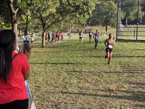 students from the track team running
