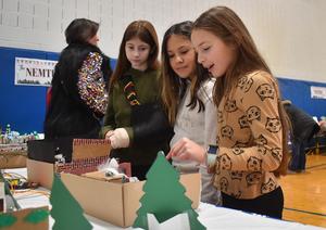 students looking at dioramas based on the movie Home Alone