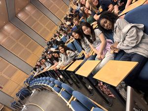 students sitting in desks at conference