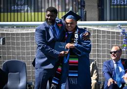 Principal and student at graduation