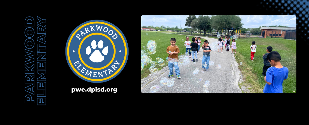 Children playing outside at Parkwood Elementary, with bubbles floating in the air.