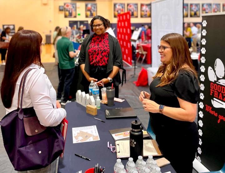 Goodwin Frazier Elementary Principal Pricelda Delgado speaks with job fair participants