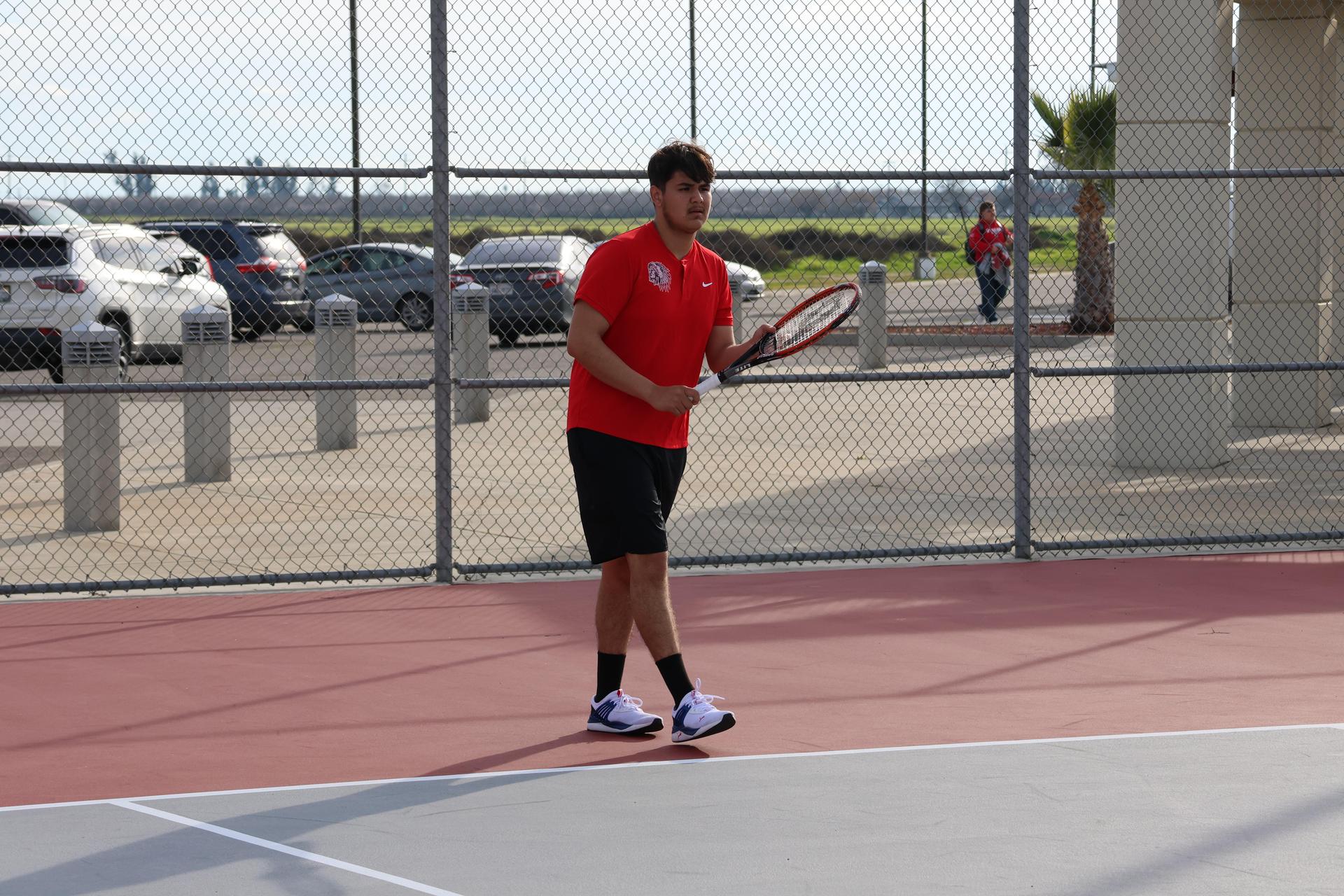 CUHS Boys playing tennis against coalinga