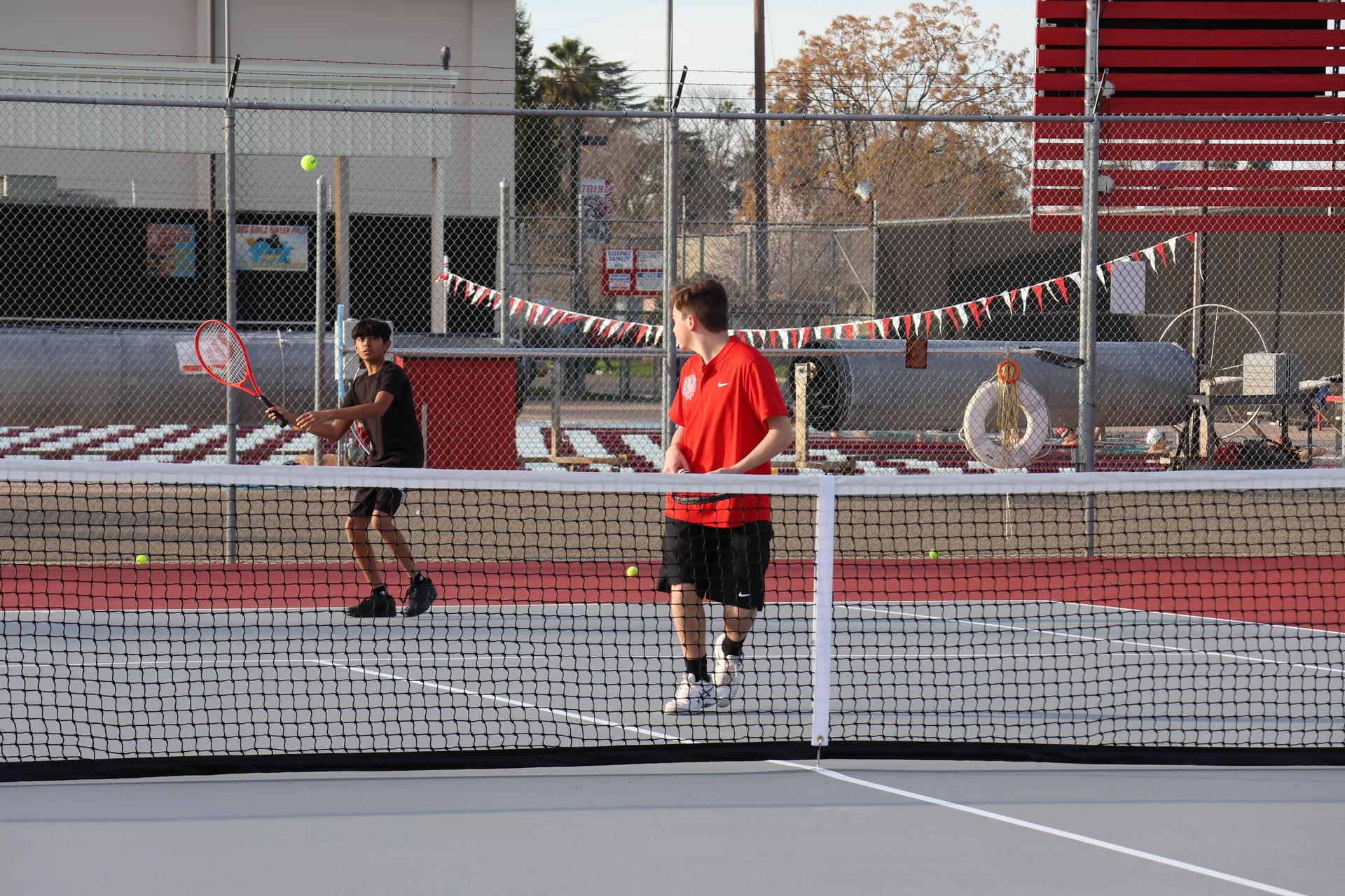 CUHS Boys playing tennis against coalinga