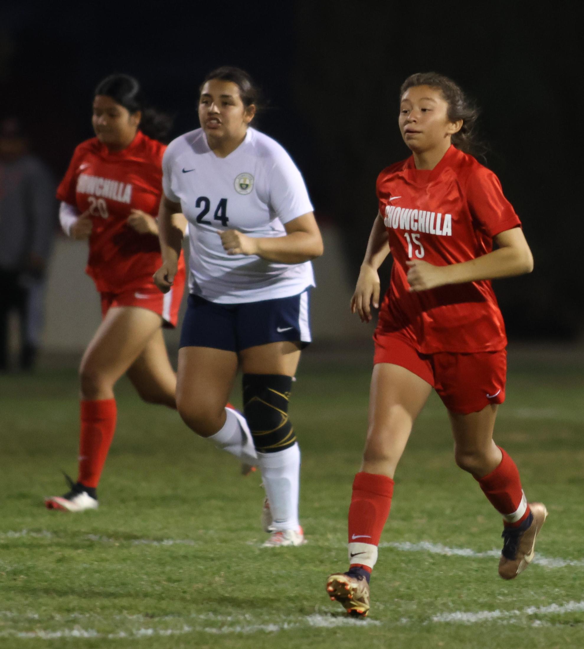 Varsity girls playing soccer against sunnyside