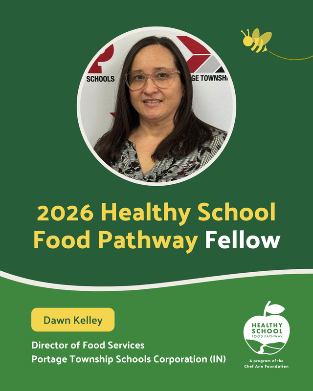 Woman with long hair smiling, standing in front of a logo and text backdrop.