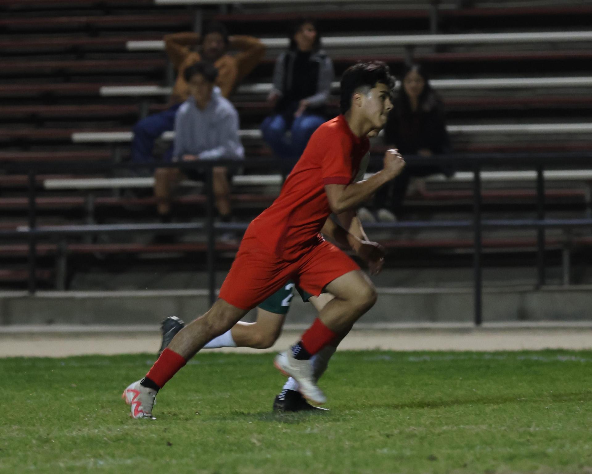 Varsity boys play soccer against Kingsburg