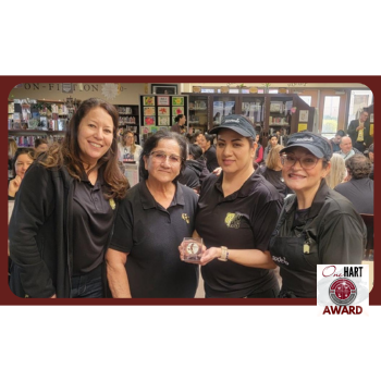 Four women posing for the camera
