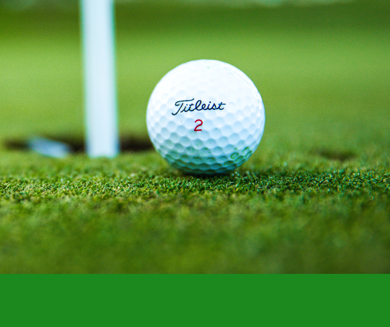 golf ball at golf hole