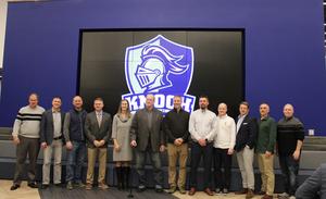 members of the sports hall of fame lined up on wall