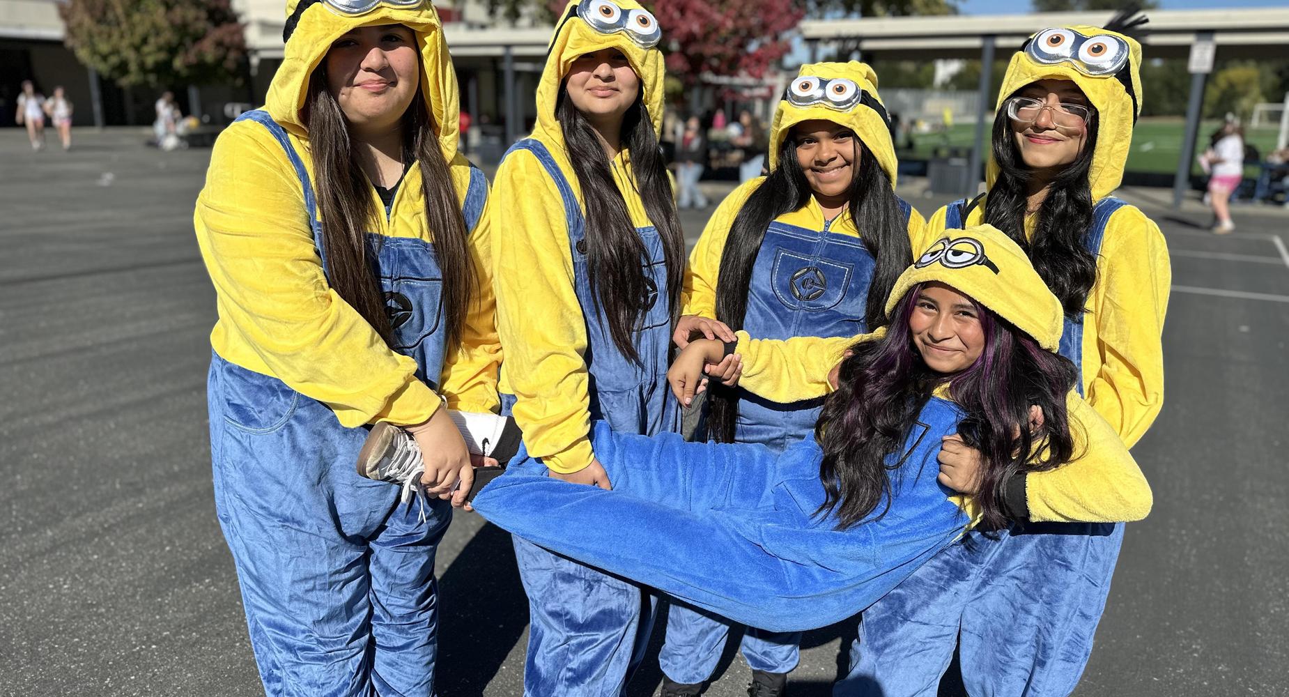 Five students dressed as minions.