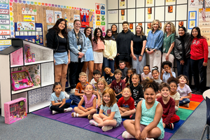Legacy Elementary pre-k class and MHS interior design students at dollhouse delivery