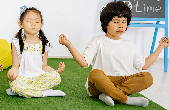 two students meditating