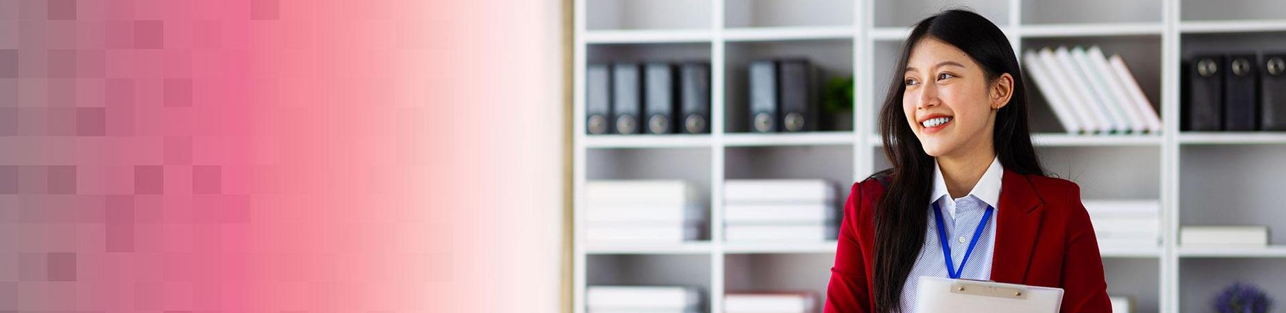 person holding a clipboard in front of a bookshelf