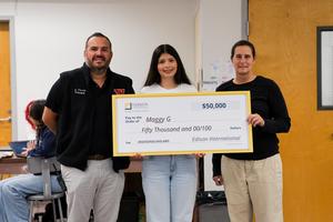 Whittier High School senior Maggy Guerrero is surprised by an Edison International representative.