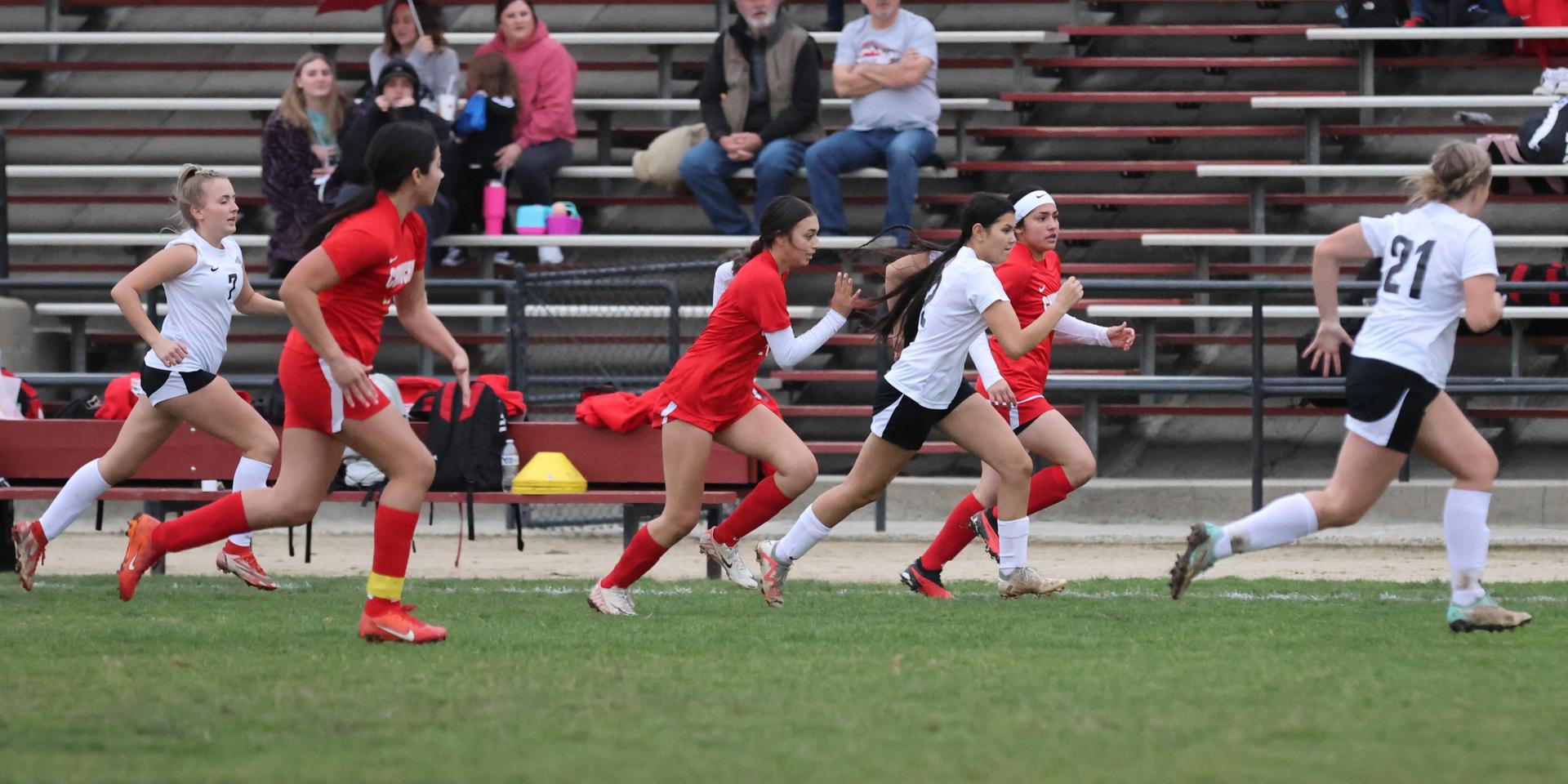 Junior Varisty girls playing soccer against liberty