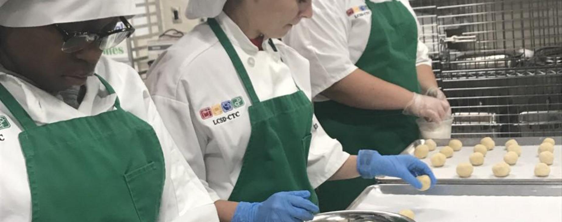 Culinary makes cookies for Open house