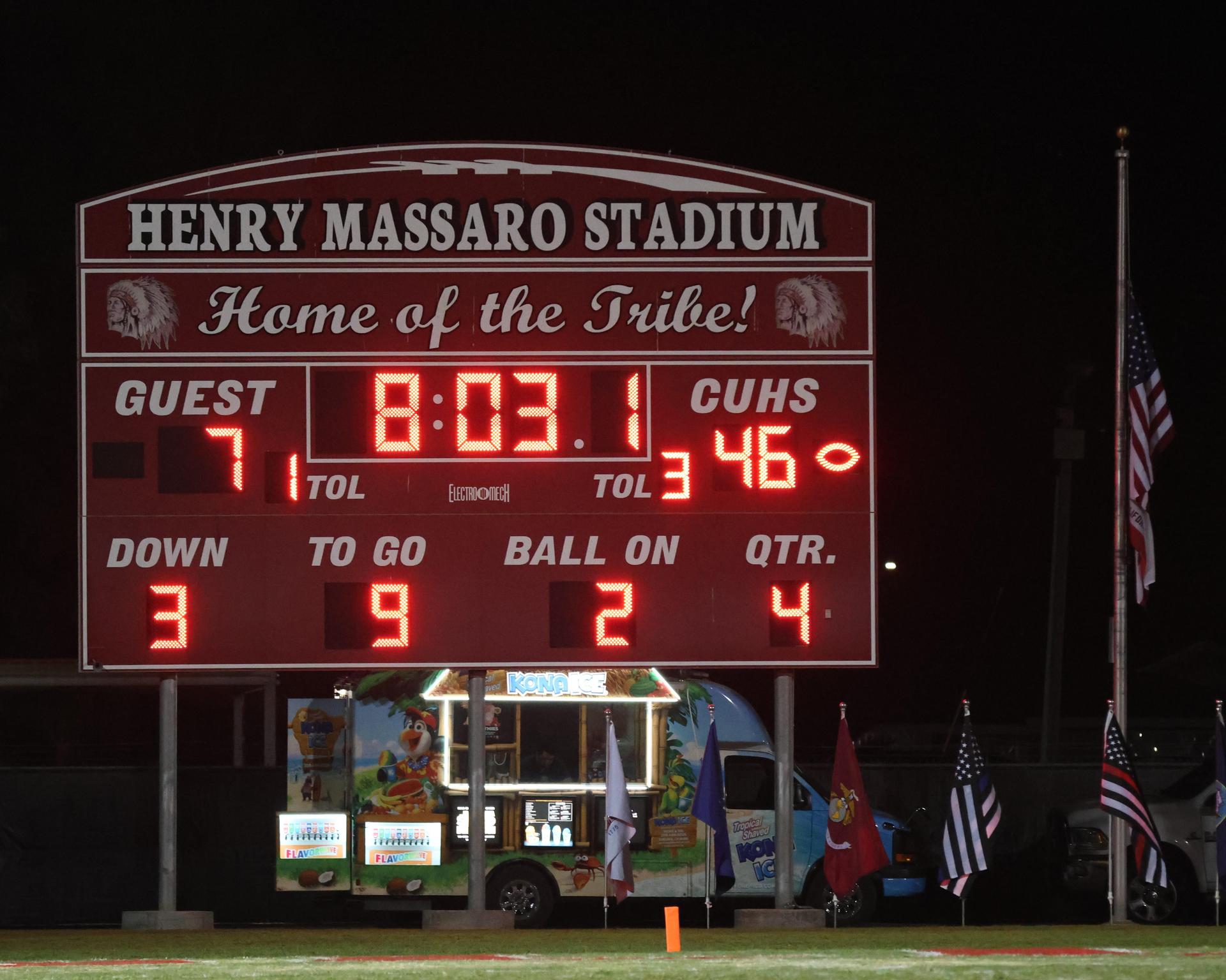 Varsity football players in action against Parlier 126