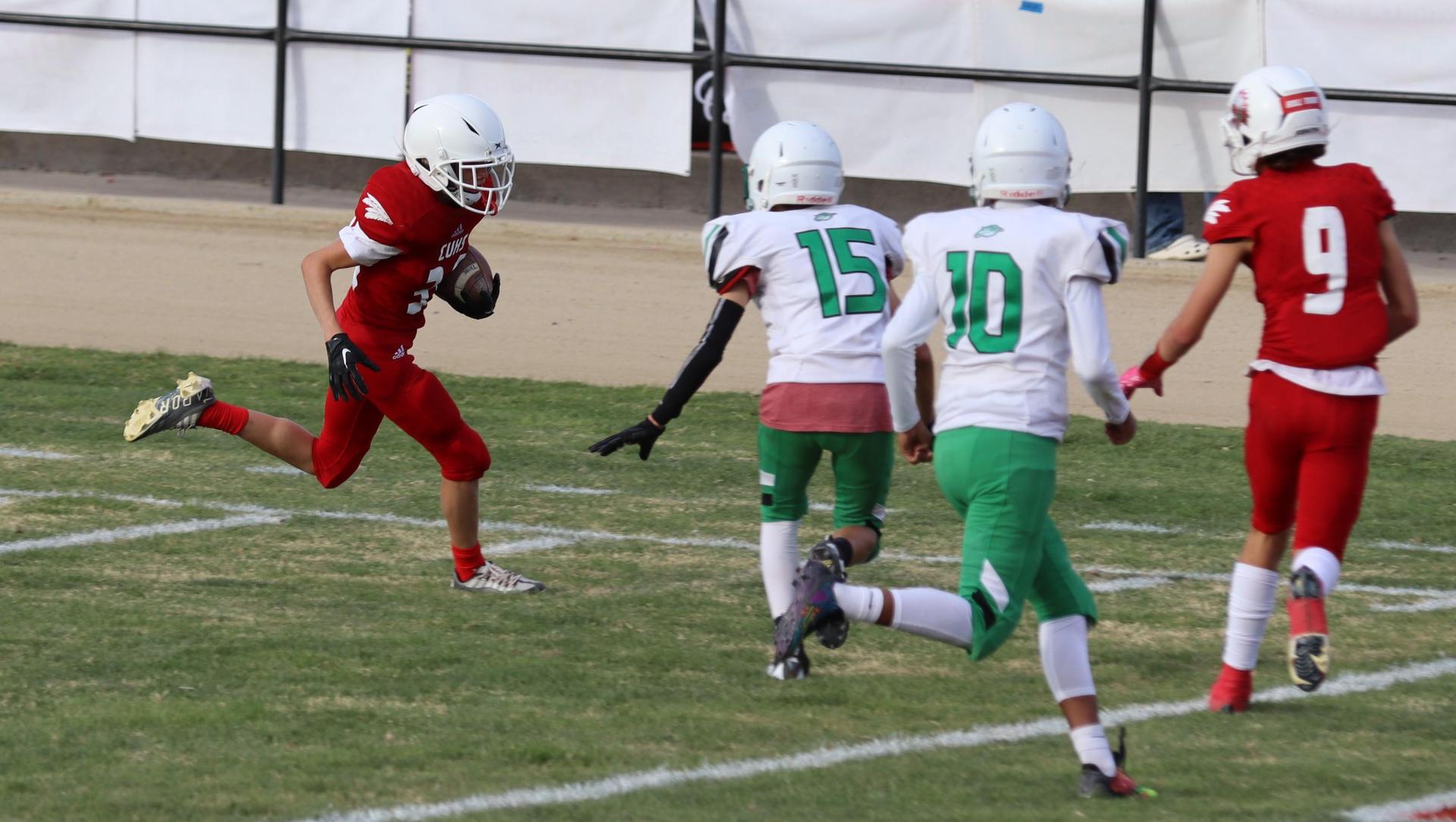  junior varsity football players in action against riverdale
