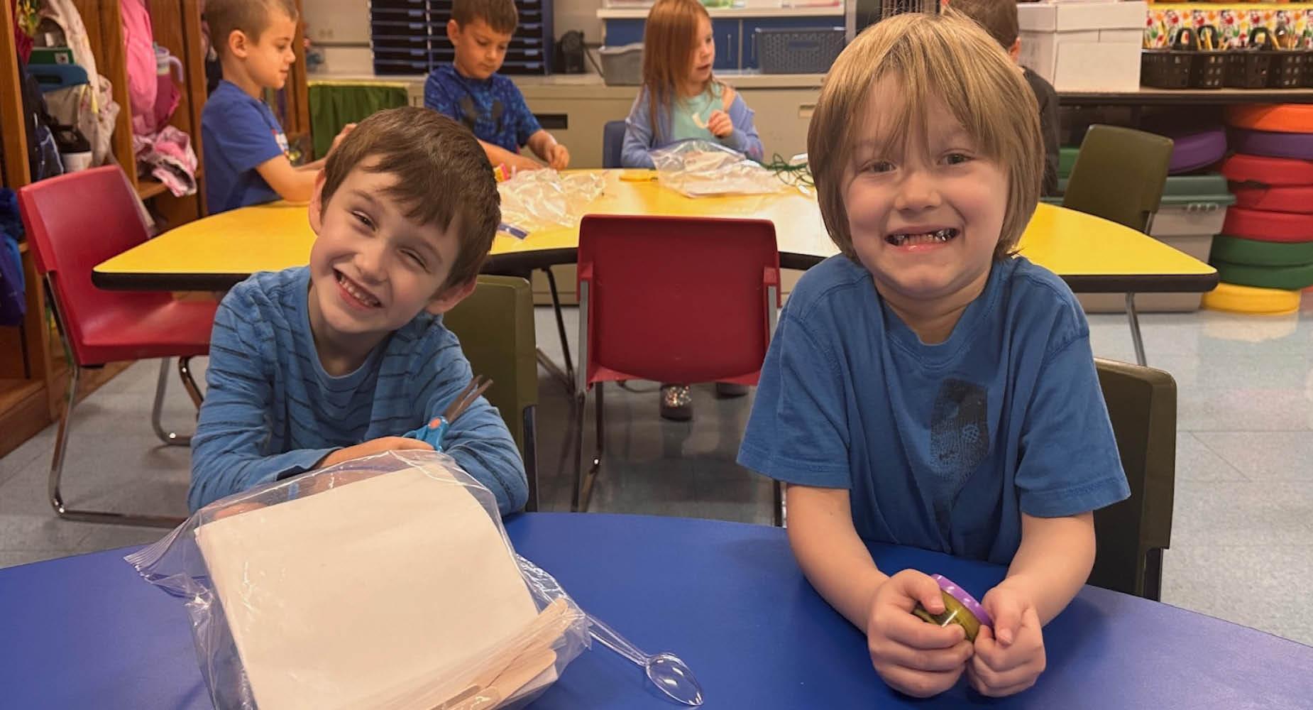 McCullough Elementary students smile while beginning their Junkbox War project in October