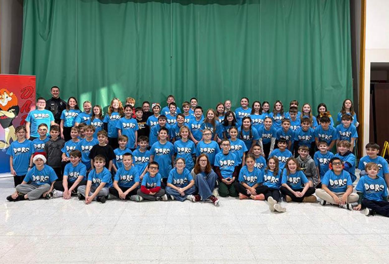 McCullough 5th-graders celebrate completion of the DARE program in the multipurpose room