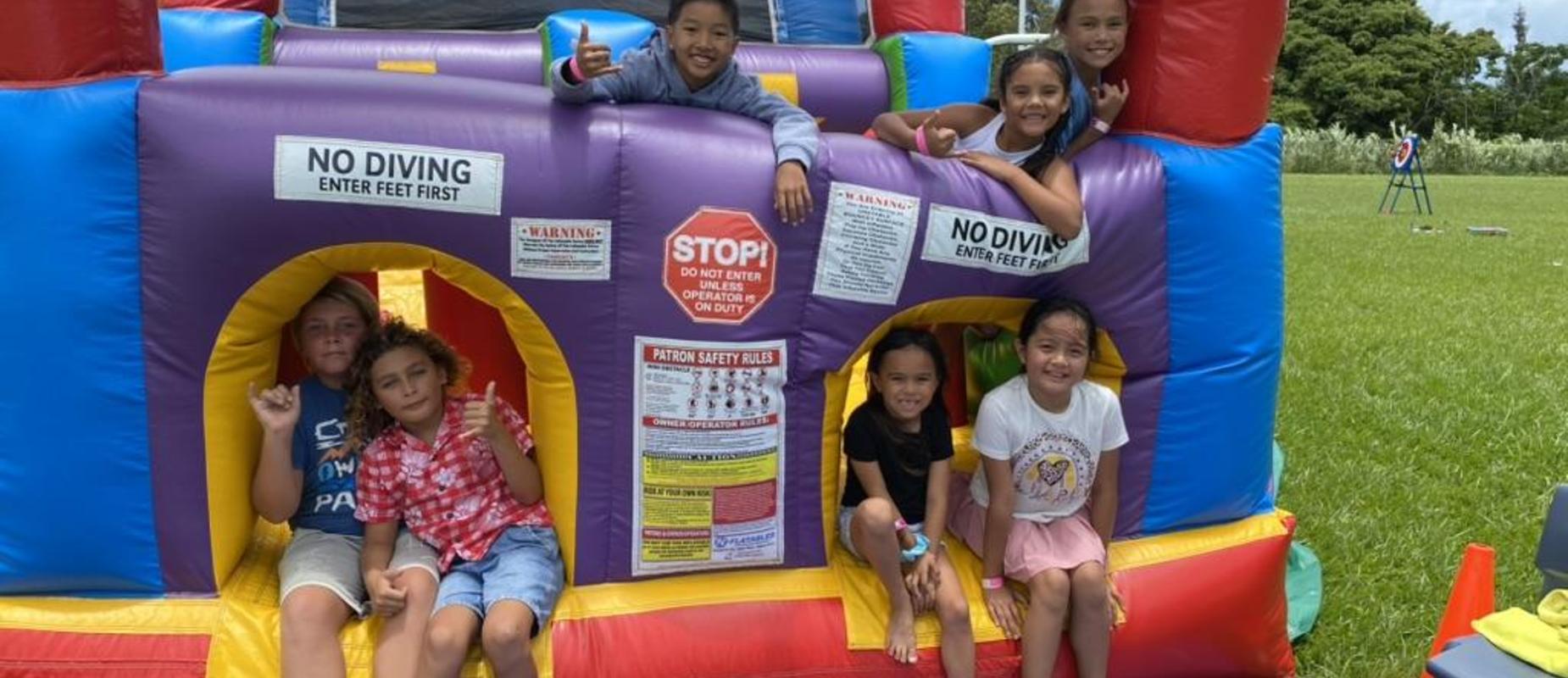 Students on bouncer at the Bounce to Summer event