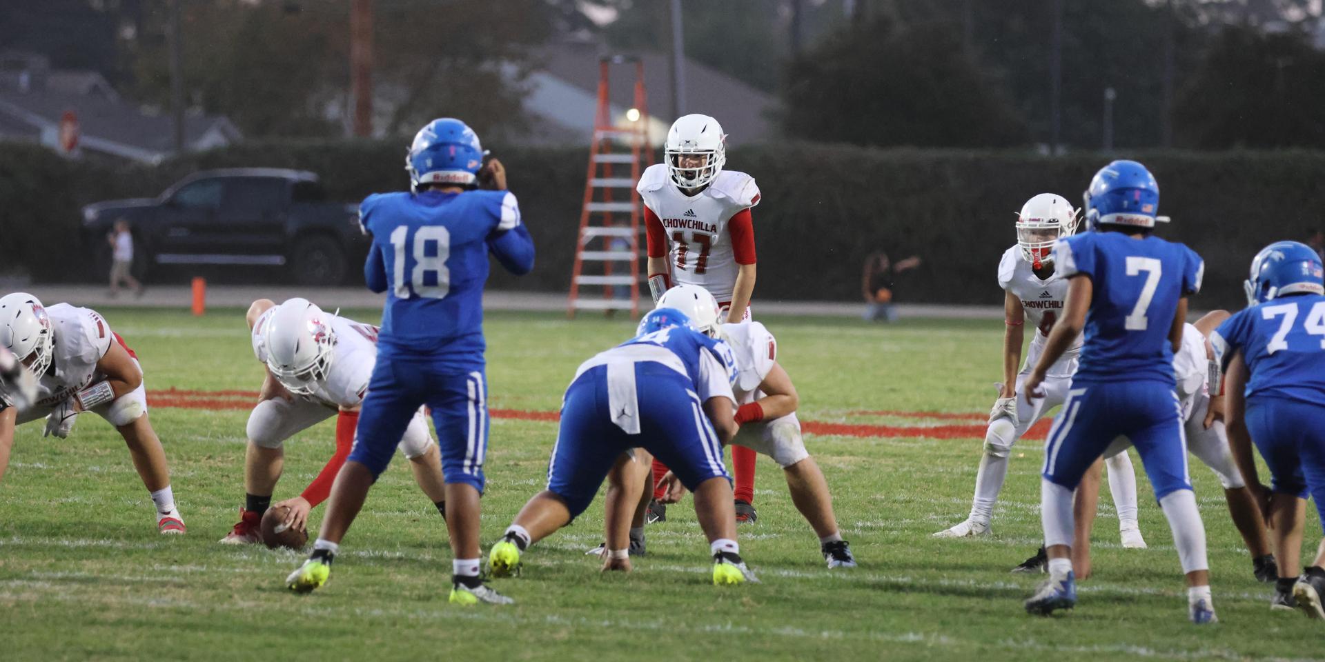 Junior Varsity football players in action against Caruthers