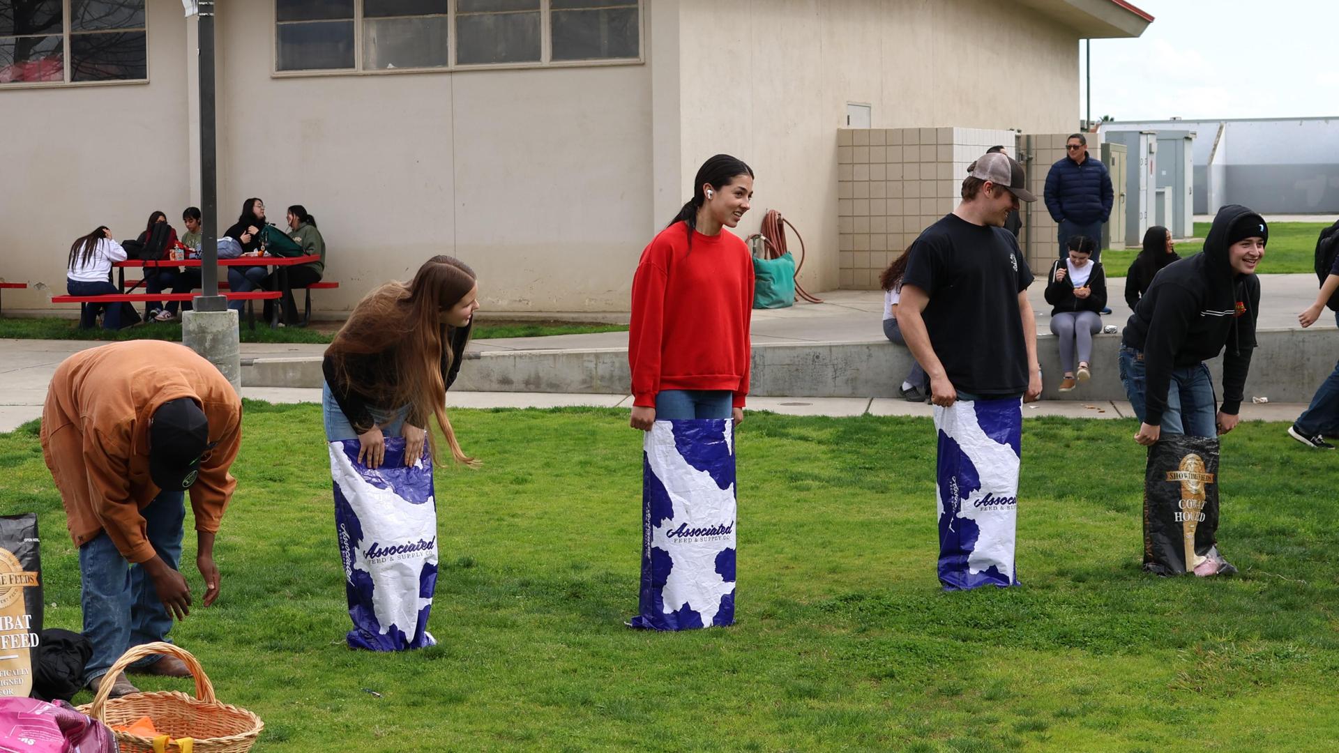 students and staff enjoying the feed bag relay