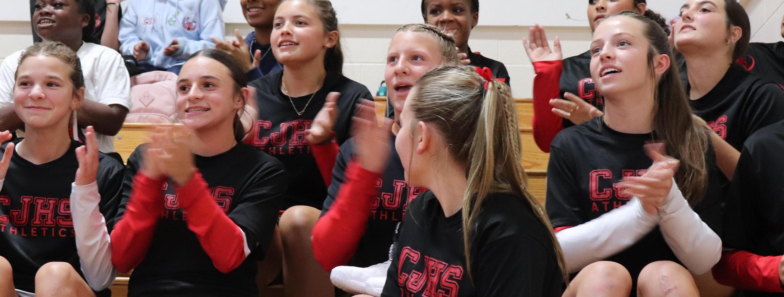 Kids cheering for vball